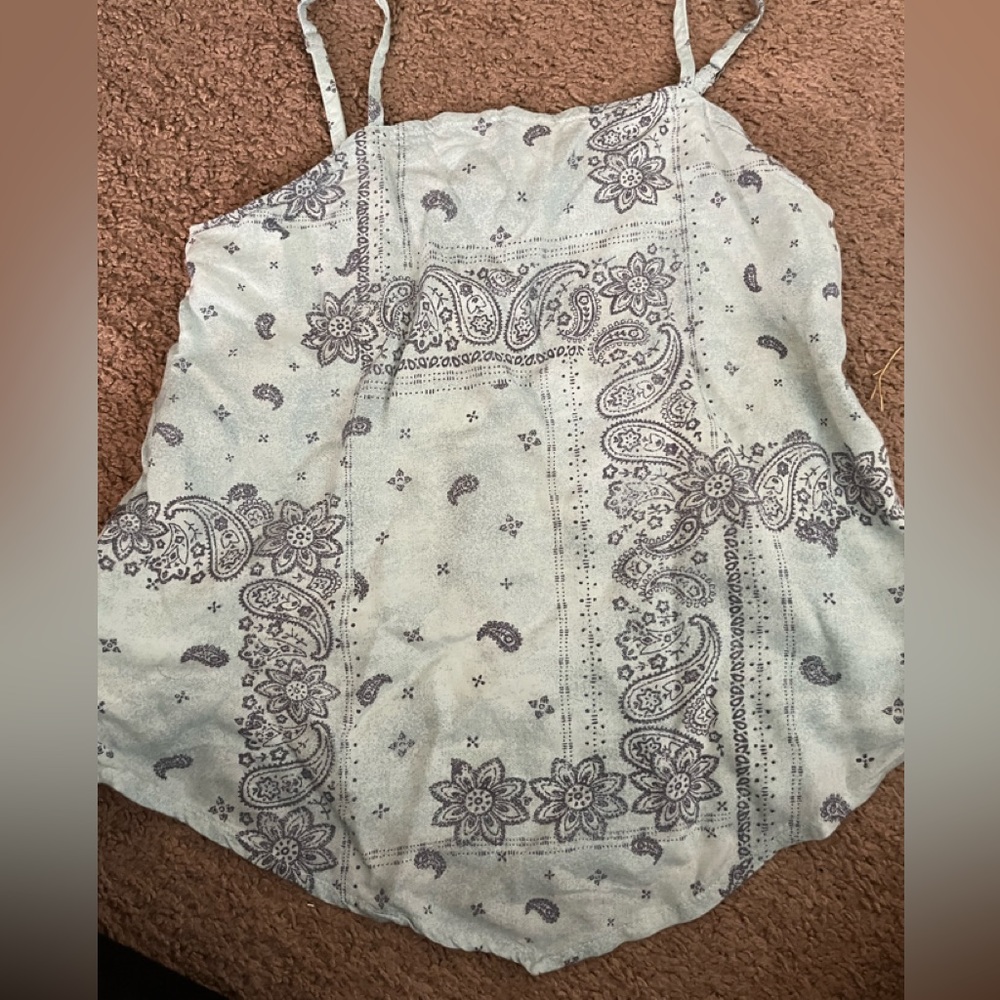 Cute and trendy top. Worn a few times